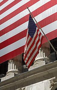 American flag in front of the Stock Exchange on Wall Street, Lower Manhattan, New York City, New York, USA