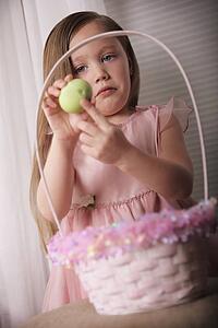 Girl with cracked Easter Egg