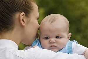 Mother holding baby boy