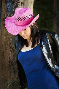 Woman wearing pink cowboy hat