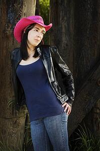 Woman wearing pink cowboy hat