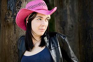 Woman wearing pink cowboy hat