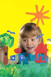 Girl painting on glass