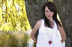 Teen girl with a heart necklace