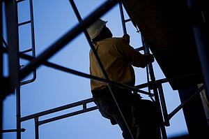 Construction worker climbing