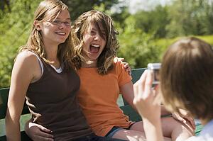 Teenage girls laughing