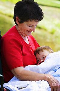 A woman holding her grandson