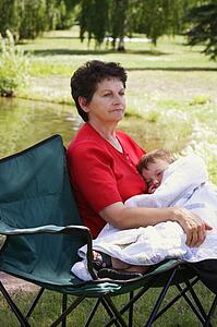A woman holding her grandson
