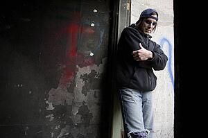 Man wearing warn out clothing