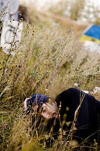 Man lying in long grass