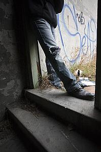 Person beside graffiti