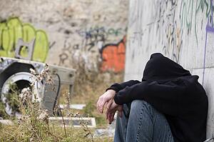 Man beside graffiti