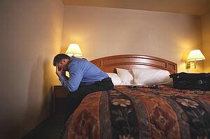 A businessman in hotel room