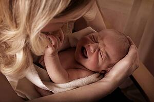 Mother soothing a crying baby 