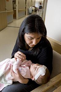 Woman holding baby girl