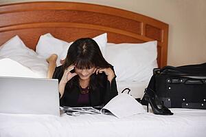 Woman working on bed
