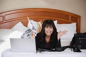 Woman working on bed