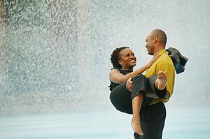 Couple enjoy water on a hot day