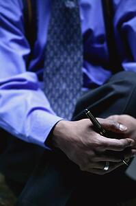 Businessman holds pen