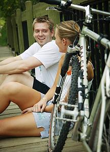 Couple relaxing after bike ride