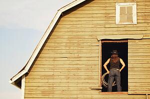 Cowgirl in barn