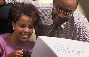 Business People in front of computer monitor