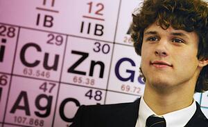 Male teenage student in front of chart