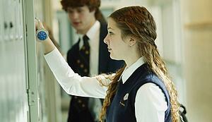 Female student opening locker