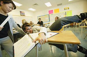 Student falling out of desk