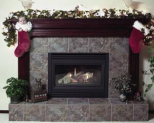 Baby in Christmas stocking by fireplace