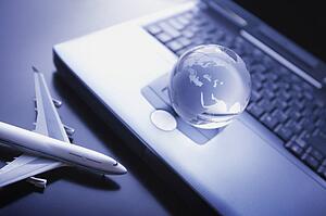 Globe with keyboard and airplane