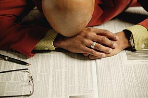 Man lays on newspaper