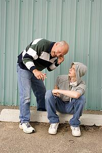 Grandfather and grandson listening to music