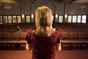 Woman at the front of an empty room
