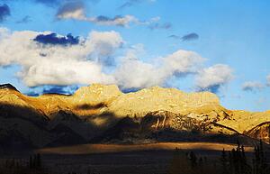 Blue sky with clouds over mountains in Jasper, Alberta, Canada