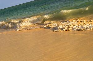 Waves rolling in on tropical beach