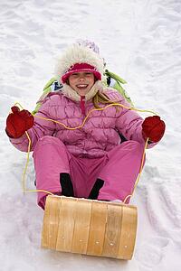Children tobogganing 