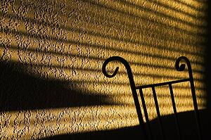 Shadows from window cast on wall