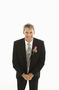 Groom with hands clasped 