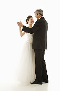 Portrait of bride and groom dancing