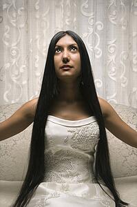 Portrait of an Indian bride looking up.