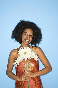Woman holding fake flowers