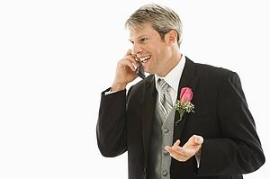 Groom talking on cellphone