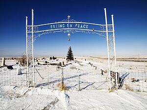 Entrance to graveyard reading esting in peace.