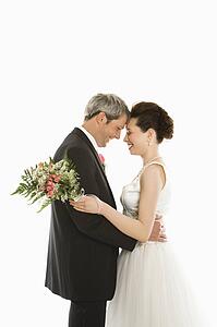 Groom and bride embracing