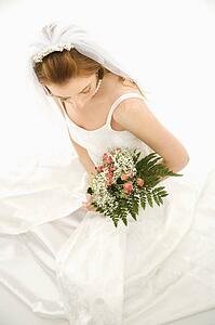 Portrait of a bride holding bouquet