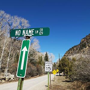 Several street signs along side of road in Utah, USA.