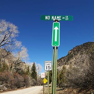 Several street signs along side of road in Utah, USA.