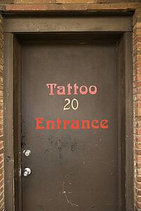 Doorway entrance to tattoo parlor.