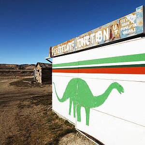 Small building iwht dinosaur painted on side in Crescent Junction, Utah. 